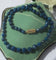 Collier Collier en chute en pierres bleues naturelles et fermoir or rose émaillé 58 Facettes Collier