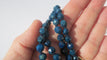 Collier Collier en chute en pierres bleues naturelles et fermoir or rose émaillé 58 Facettes Collier