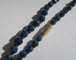 Collier Collier en chute en pierres bleues naturelles et fermoir or rose émaillé 58 Facettes Collier