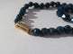 Collier Collier en chute en pierres bleues naturelles et fermoir or rose émaillé 58 Facettes Collier