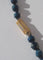 Collier Collier en chute en pierres bleues naturelles et fermoir or rose émaillé 58 Facettes Collier