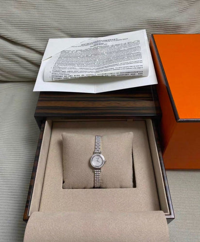 Montre Hermès Faubourg - Montre en or blanc et diamants 58 Facettes jnci76