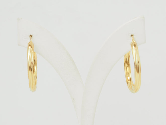 Boucles d'oreilles Boucles d'oreilles créoles torsadées en or jaune 18 carats 58 Facettes Mtor