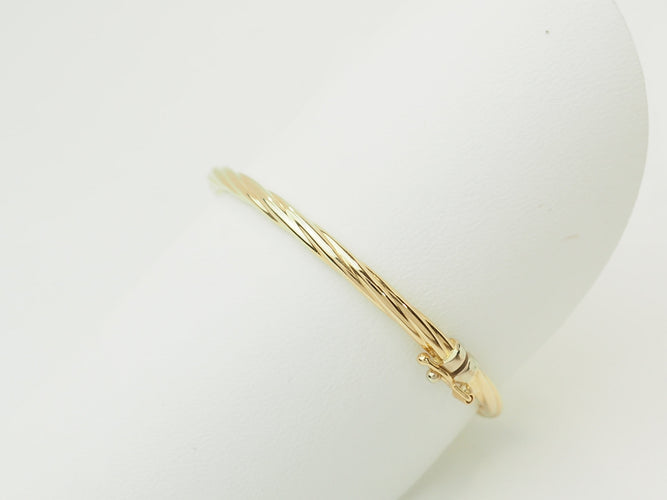 Bracelet Bracelet enfant ouvrant jonc torsadé en or jaune 58 Facettes 33634