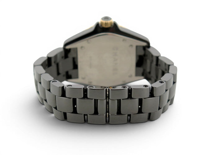 Montre Chanel J12 - Montre 38 mm en céramique noire, or jaune et diamants 58 Facettes 275095