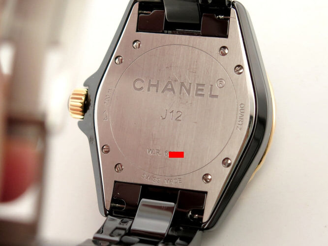 Montre Chanel J12 - Montre 38 mm en céramique noire, or jaune et diamants 58 Facettes 275095