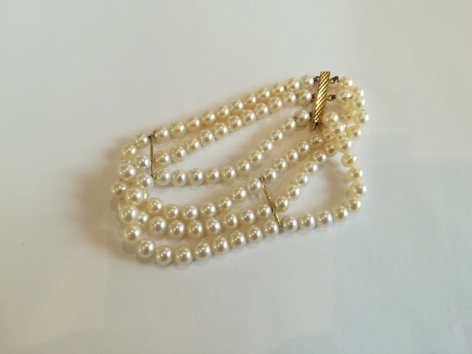 Bracelet Bracelet 3 rangs en or jaune et perles de culture 58 Facettes BRA 001