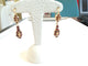 Boucles d'oreilles Demi-parure - Bracelet et boucles d'oreilles en or jaune et grenats 58 Facettes PAR 001