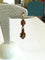 Boucles d'oreilles Demi-parure - Bracelet et boucles d'oreilles en or jaune et grenats 58 Facettes PAR 001