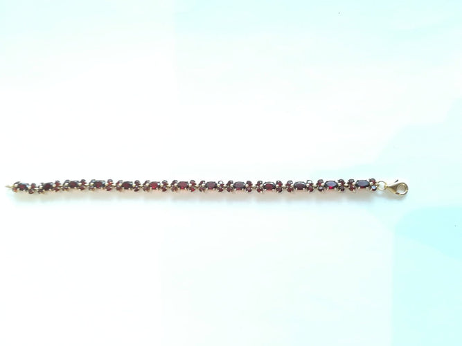 Bracelet Bracelet en or jaune et grenats 58 Facettes BRA 002