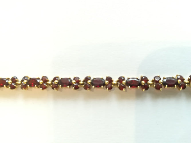 Bracelet Bracelet en or jaune et grenats 58 Facettes BRA 002