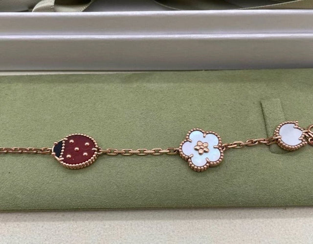 Bracelet Van Cleef & Arpels Lucky Spring - Bracelet 5 motifs en or rose et pierres 58 Facettes jnci89