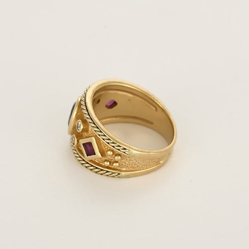 Bague 52 Bague d'archer en or jaune, saphir, diamants et rubis 58 Facettes B250394