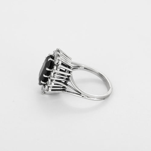 Bague 52 Bague marguerite en or blanc, saphir et diamants 58 Facettes B260316
