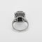 Bague 52 Bague marguerite en or blanc, saphir et diamants 58 Facettes B260316