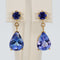 Boucles d'oreilles Boucles d'oreilles en or jaune 14 ct, tanzanites et saphirs bleus 58 Facettes E028
