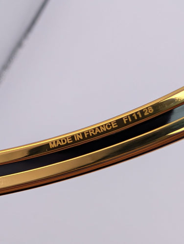 Bracelet Hermès - Bracelet jonc en plaqué or et émail 58 Facettes 1253
