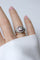Bague 52 Bague dôme Art déco en platine, diamant coussin et rubis 58 Facettes
