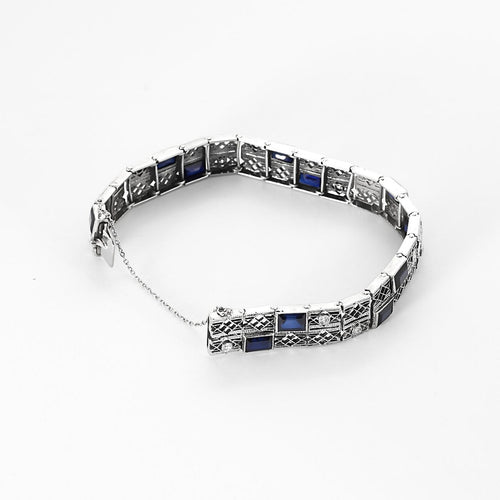 Bracelet Bracelet articulé en or blanc, diamants et saphirs de synthèse 58 Facettes B260353