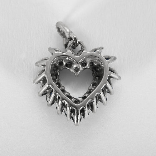 Pendentif Pendentif Cœur en or gris, diamants et saphirs 58 Facettes B250604