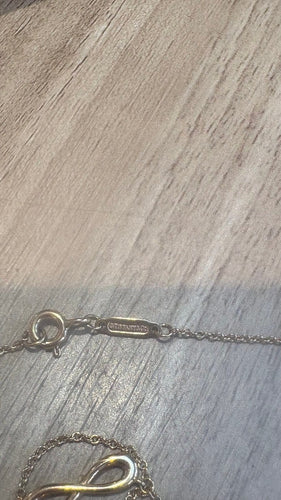 Collier Tiffany & Co Infini - Collier en or jaune 58 Facettes Collier 001
