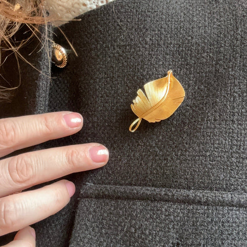 Broche Hermès - Broche Plume en or jaune 58 Facettes REF23126CF