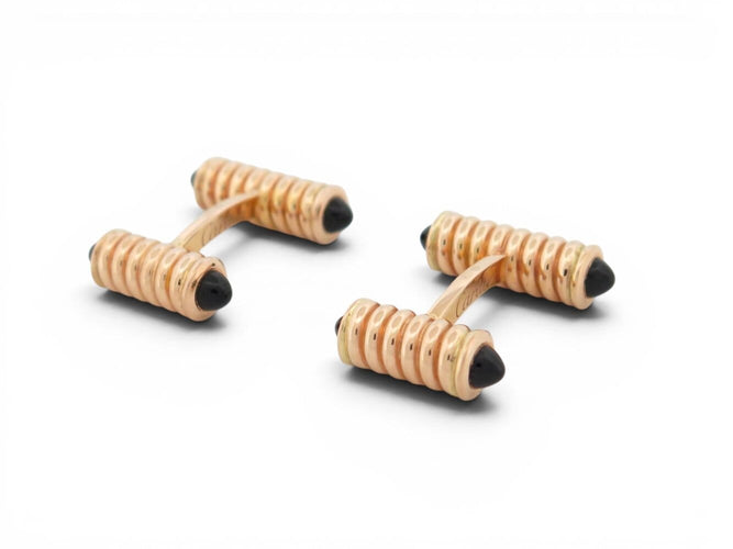 Boutons de manchette Cartier Décors Ressorts - Boutons de manchette en or rose et onyx 58 Facettes 274667