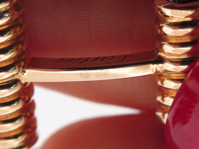 Boutons de manchette Cartier Décors Ressorts - Boutons de manchette en or rose et onyx 58 Facettes 274667