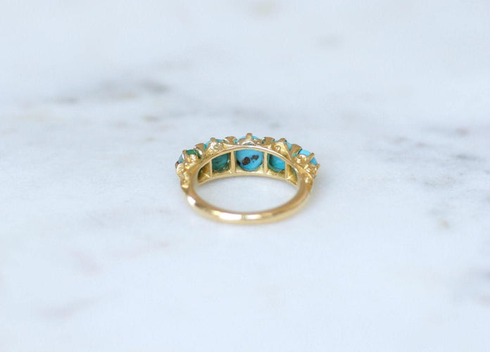Bague 53 Bague jarretière en or jaune, turquoises et diamants 58 Facettes