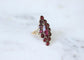 Bague Bague marquise ancienne en or rose et grenats de Perpignan 58 Facettes