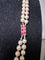 Collier Collier double rang Akoya en or jaune, grenats et diamants 58 Facettes 933