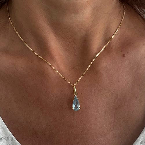 Collier Collier avec pendentif en or jaune et aigue-marine 58 Facettes 40531
