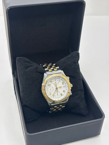 Breitling Chronomat - Montre en or et acier 58 Facettes 2036