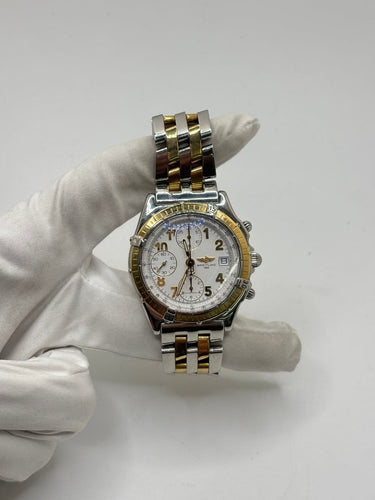 Breitling Chronomat - Montre en or et acier 58 Facettes 2036
