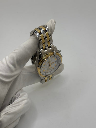 Breitling Chronomat - Montre en or et acier 58 Facettes 2036