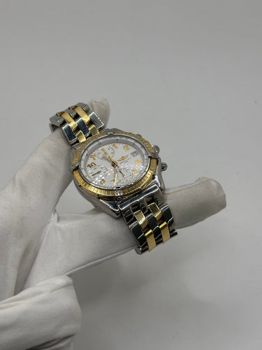Breitling Chronomat - Montre en or et acier 58 Facettes 2036