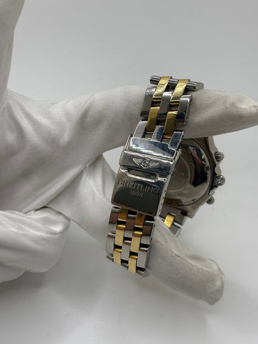 Breitling Chronomat - Montre en or et acier 58 Facettes 2036