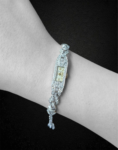 Montre Astin - Montre bracelet Art déco en or blanc 18 carats et diamants 58 Facettes