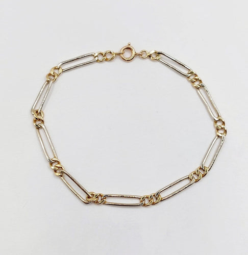 Bracelet vintage maille Figaro en or blanc et jaune 18k 58 Facettes A07559