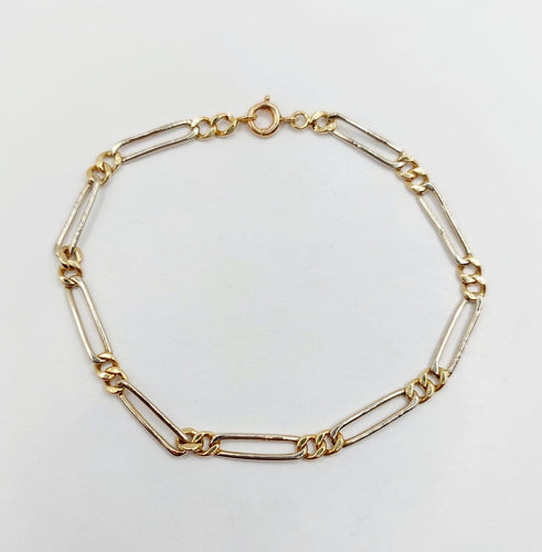 Bracelet vintage maille Figaro en or blanc et jaune 18k 58 Facettes A07559