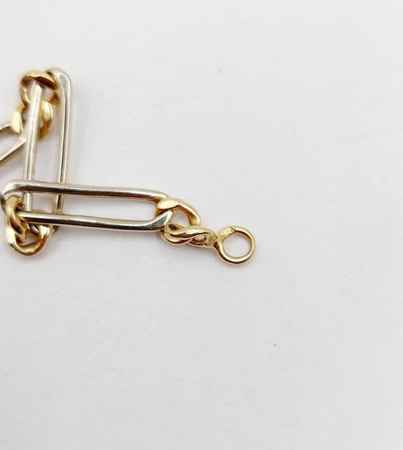 Bracelet vintage maille Figaro en or blanc et jaune 18k 58 Facettes A07559