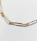 Bracelet vintage maille Figaro en or blanc et jaune 18k 58 Facettes A07559