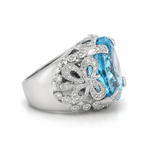55 Bague en or blanc, topaze et diamants 58 Facettes 1.0000076/2