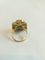 54 Bague cocktail en or jaune et blanc, péridot et diamants 58 Facettes 01374
