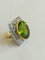 54 Bague cocktail en or jaune et blanc, péridot et diamants 58 Facettes 01374