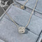 Embrace - Collier halo 0,15 ct en or blanc 18K et diamants 58 Facettes GPD1089WG
