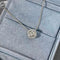 Embrace - Collier halo 0,15 ct en or blanc 18K et diamants 58 Facettes GPD1089WG
