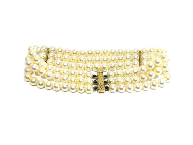 Bracelet en or jaune 18 carats et perles de culture 58 Facettes 1794592