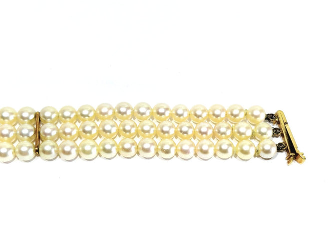Bracelet en or jaune 18 carats et perles de culture 58 Facettes 1794592