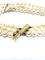 Bracelet en or jaune 18 carats et perles de culture 58 Facettes 1794592